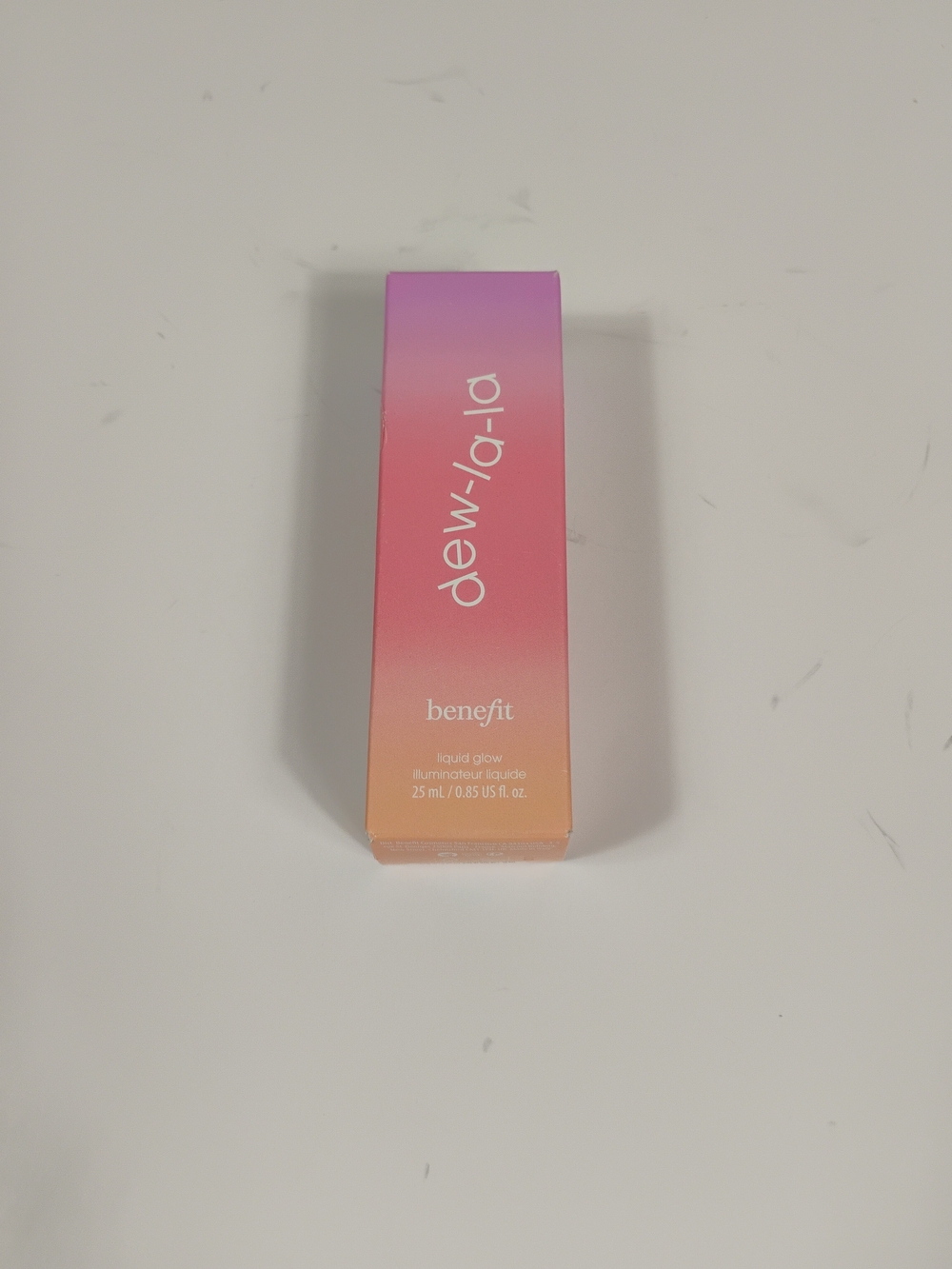 Benefit Dew-la-la Liquid Glow - Pink, Peach, Purple Gradient Packaging